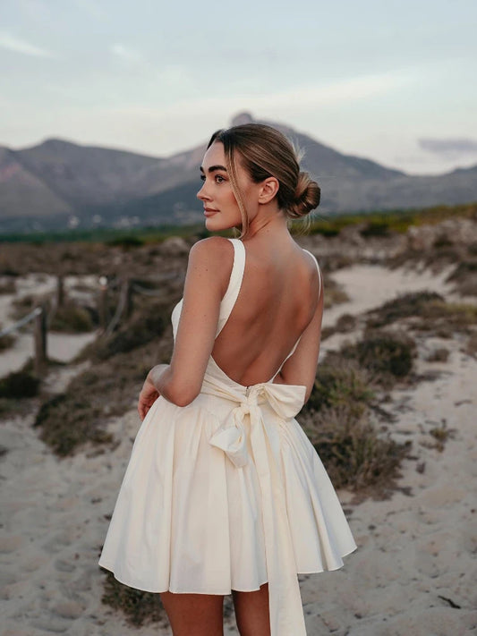 Elegant White Backless Dress with Bow
